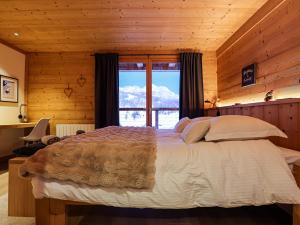 Giường trong phòng chung tại Chalet Cerf Blanc