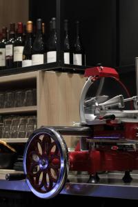 a red machine in front of bottles of wine at Campanile Shanghai Bund Hotel in Shanghai