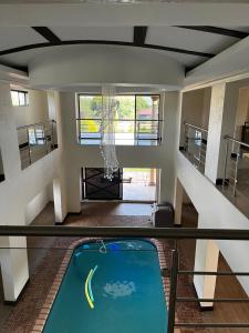 a view from the second floor of a house with a pool at Paradiso Palazzo in Welkom