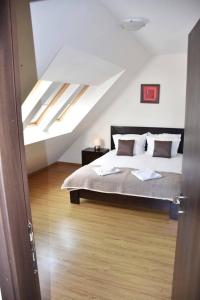 a bedroom with a bed in a attic at Luxury Chalet in Borovets, Rila Views & Fireplace in Borovets