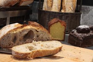 a loaf of bread sitting on top of a cutting board at Campanile Shanghai Bund Hotel in Shanghai