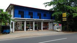 a blue building on the side of a street at Artesa 