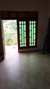 a room with doors and a tiled floor at Artesa 