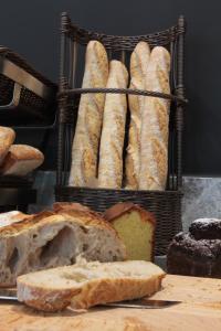 a basket filled with lots of bread on a table at Campanile Shanghai Bund Hotel in Shanghai
