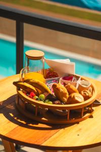 a tray of food sitting on a table at Pousada Austral Suítes in Imbituba