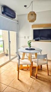 TV a/nebo společenská místnost v ubytování La Riviera CÁRCANO