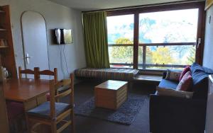 Posezení v ubytování Résidence Rouelles - Appartement 2 pièces 6 personnes à Arc 1600 en centre station et proche des pistes MAE-9221