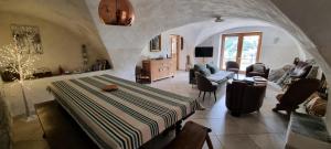 a bedroom with a bed and a living room at Chalet Le Chatelret - LE CHATELRET MAE-9361 in Vars