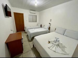 En eller flere senge i et værelse på Estância Hotel