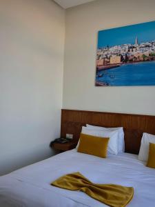 Postel nebo postele na pokoji v ubytování Hôtel Majestic Rabat Centre