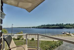 a balcony with a view of a body of water at Waterfront apartment in Gatineau