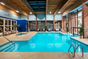 a large swimming pool with blue water in a building at Marriott Providence Downtown in Providence