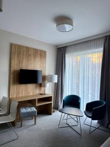 Et tv og/eller underholdning på Aparthotel Apartamenty Czarna Góra 0101