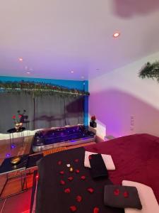 a large living room with a pool in a room at Love 2 avec Jacuzzi in Cap d'Agde