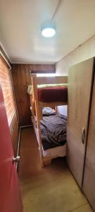 En eller flere senge i et værelse på Patagonia In Sur