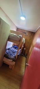 En eller flere senge i et værelse på Patagonia In Sur + 4 billeder