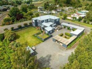 an aerial view of a large house with a yard at The Station in Hunterville