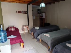 En eller flere senge i et værelse på Hospedaje 73 M