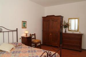 Postel nebo postele na pokoji v ubytování Agriturismo San Luigi