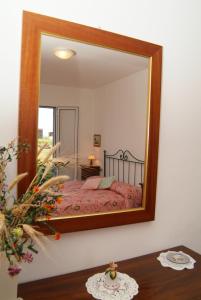 Postel nebo postele na pokoji v ubytování Agriturismo San Luigi