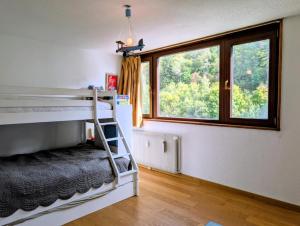 En eller flere senge i et værelse på Résidence Plandevin - 3 pièces à Arc 1600 MAE-1223