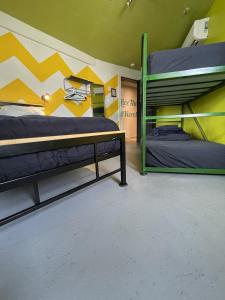 Postel nebo postele na pokoji v ubytování Auberge Alternative