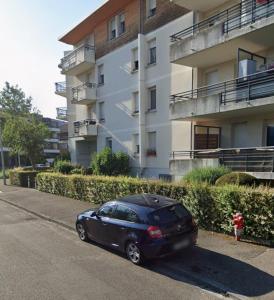 a black car parked in front of a building at Soft Touch House in Strasbourg