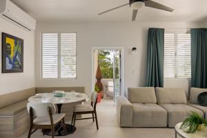 a living room with a couch and a table at Ocean Park 3BDR 2b Hot tub-Terrace Riviera Villa in San Juan
