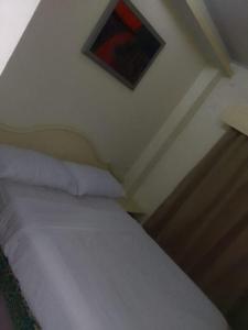 Giường trong phòng chung tại Goldenwesthotelcasino