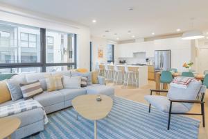 a living room with a couch and a table at Cedar Vista - condo with stunning mountain views in Revelstoke