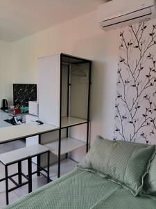 Et tv og/eller underholdning på Studio Borboletas de luz