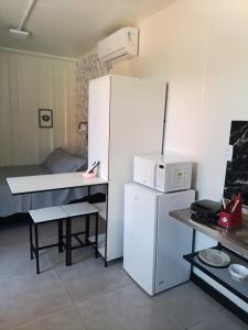 Køkken eller tekøkken på Studio Borboletas de luz