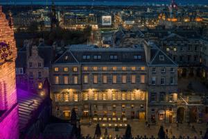 a large building in a city at night at Old Town Chambers, Autograph Collection in Edinburgh