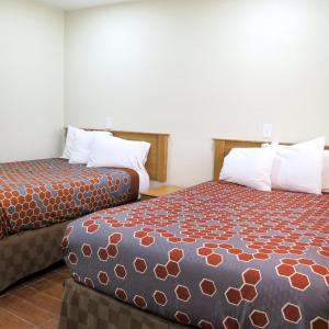 a hotel room with two beds in a room at Townhouse Inn and Suites in Brawley +40 photos