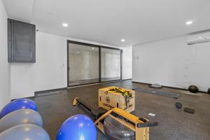 an empty room with a box and blue balloons in it at Modern Ocean View Apartment Private Balcon in Nuevo Nayarit