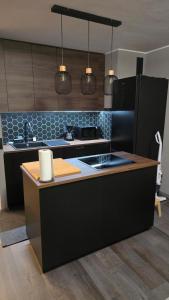 a kitchen with a stove and a counter top at WaldLoft in Todtmoos