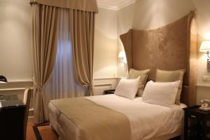 Posteľ alebo postele v izbe v ubytovaní Hotel Bologna ***S