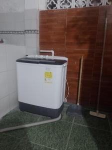 a water tank in a room with a wall at Apto central 3 hab in Apartadó