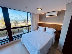 En eller flere senge i et værelse på Alta Marine