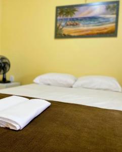 En eller flere senge i et værelse på Pousada Santa terezinha + 8 billeder