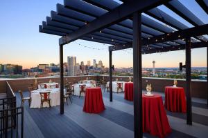 a restaurant with tables and chairs on a roof at Fairfield Inn & Suites by Marriott Denver Downtown in Denver