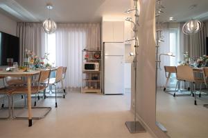 a kitchen and dining room with a table and a refrigerator at Stay BUT SEONGSU in Seoul
