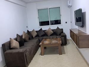 TV a/nebo společenská místnost v ubytování Baya Residentie