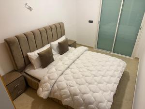 Postel nebo postele na pokoji v ubytování Baya Residentie