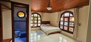 En eller flere senge i et værelse på Casa Colonia Duitama Tu refugio en Boyacá