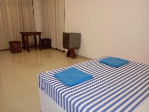 Postel nebo postele na pokoji v ubytování Hotel Asha safari