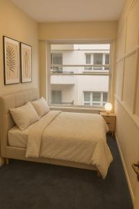 Giường trong phòng chung tại HouseCheconquista