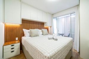 En eller flere senge i et værelse på Riviera Vista Mar 2 Qt e Piscina by Achei Camboriú + 47 billeder