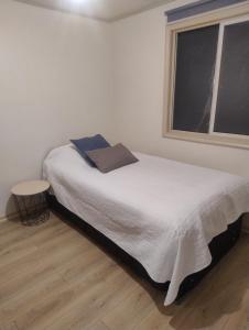 Ένα ή περισσότερα κρεβάτια σε δωμάτιο στο Temporada de verano Puerto Varas