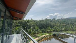 a balcony of a building with a bridge over a river at Thiên Vy Homestay in Phu Quoc
